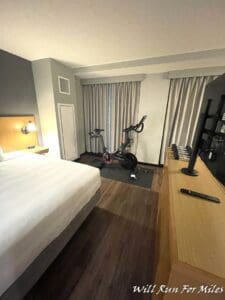 a room with a bed and a bike