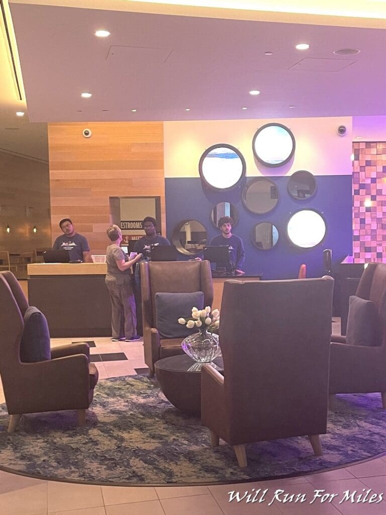 a group of people standing in a lobby