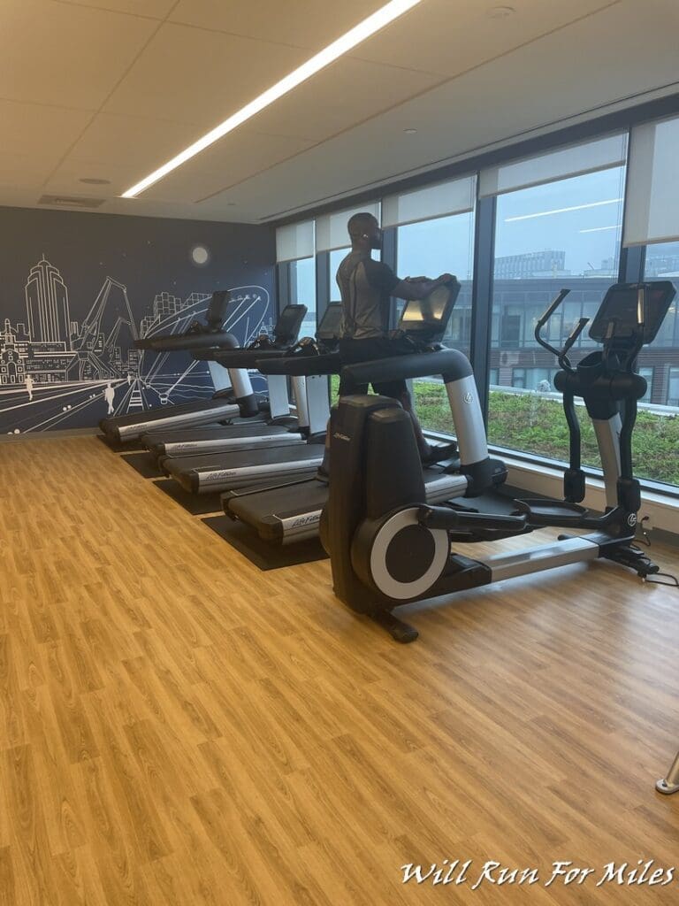 a man on treadmills in a gym