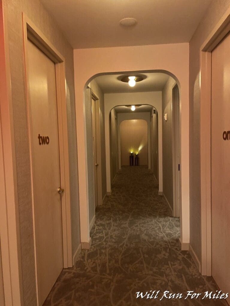 a hallway with doors and lights