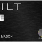 a black credit card with silver and black text