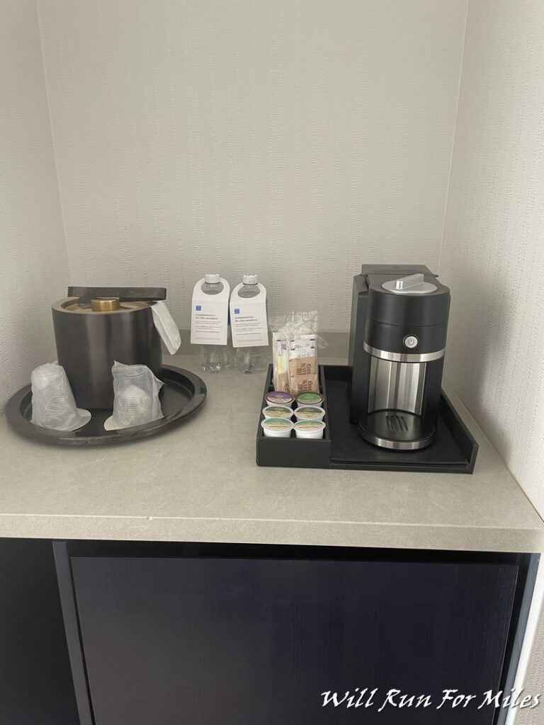 a coffee machine and coffee cups on a counter