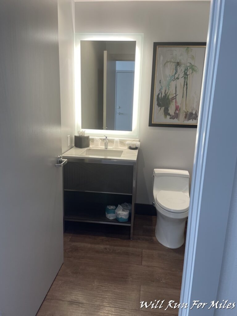 a bathroom with a mirror and sink