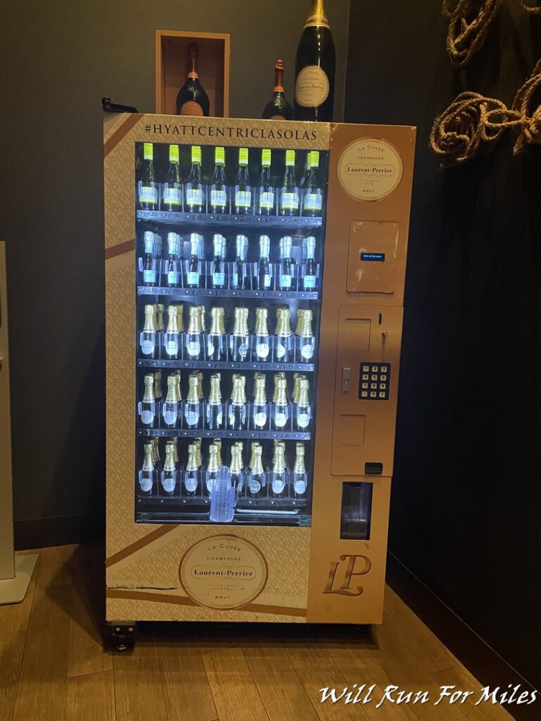 a vending machine with bottles of wine