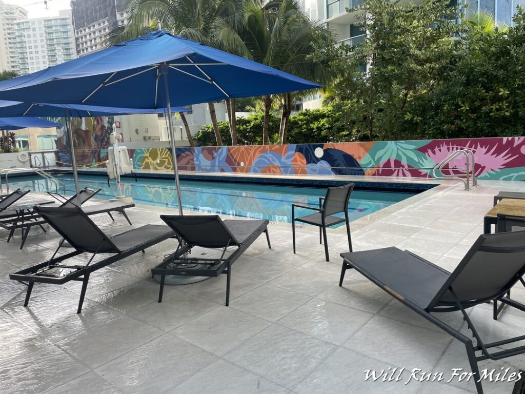 chairs and umbrellas by a pool