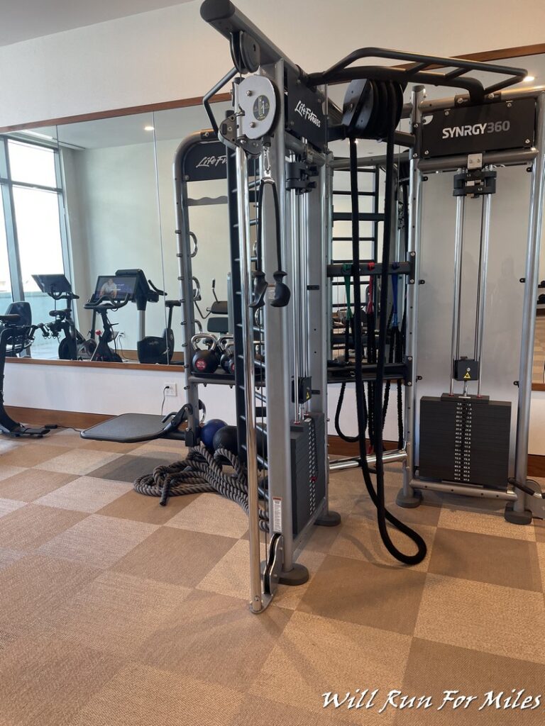 a group of exercise equipment in a gym