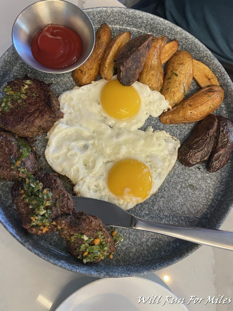 a plate of food with eggs and potatoes