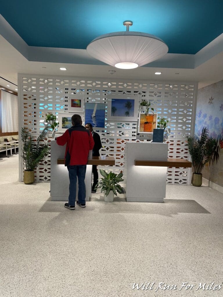 a man standing at a reception desk