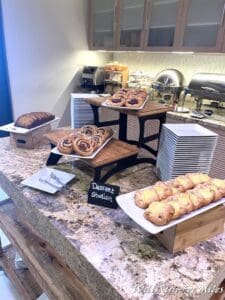 a buffet table with different pastries