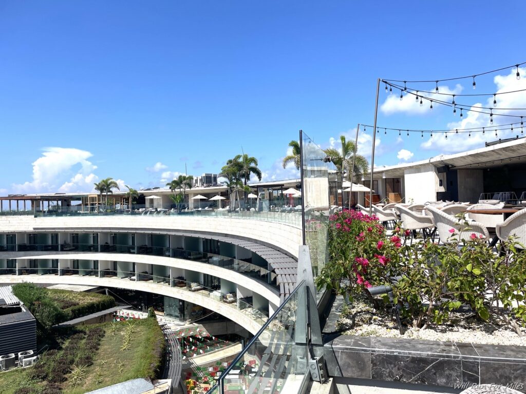 a building with a balcony and a garden