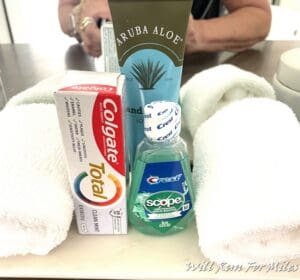 a group of toothpaste and a tube of toothpaste on a table
