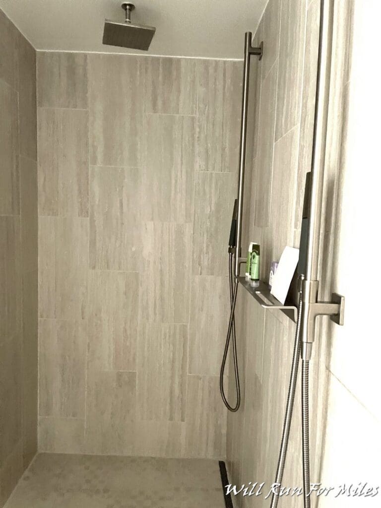 a shower with a shower head and a shower head