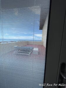 a window with blinds on the outside of a building