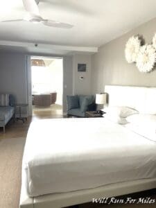 a bedroom with a large bed and a couch