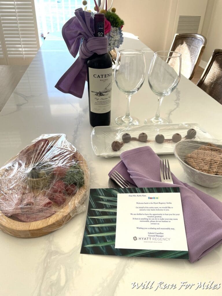 a wine bottle and wine glasses on a table