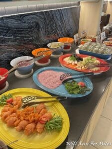a buffet table with different plates of food