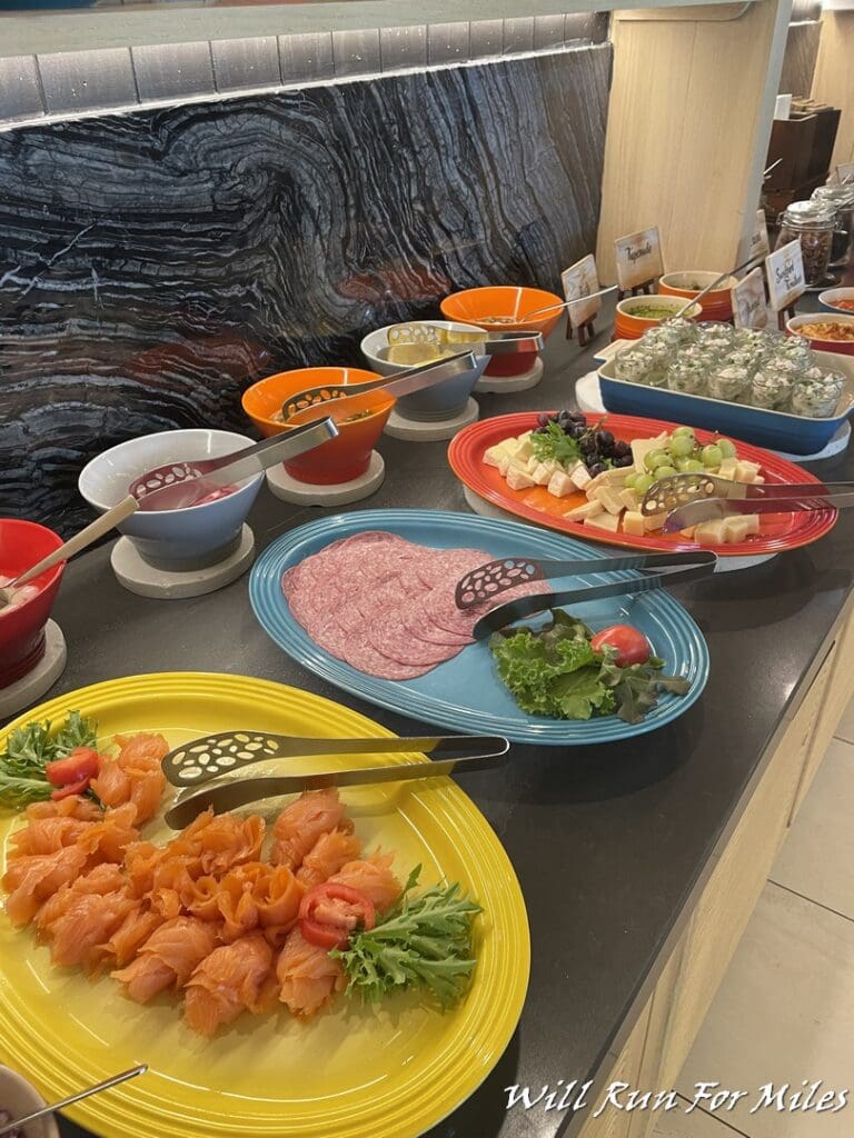 a buffet table with different plates of food