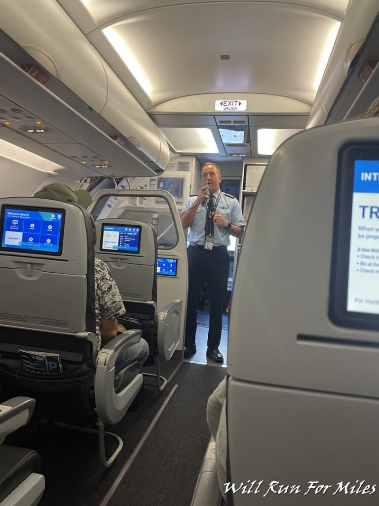 a man standing in an airplane