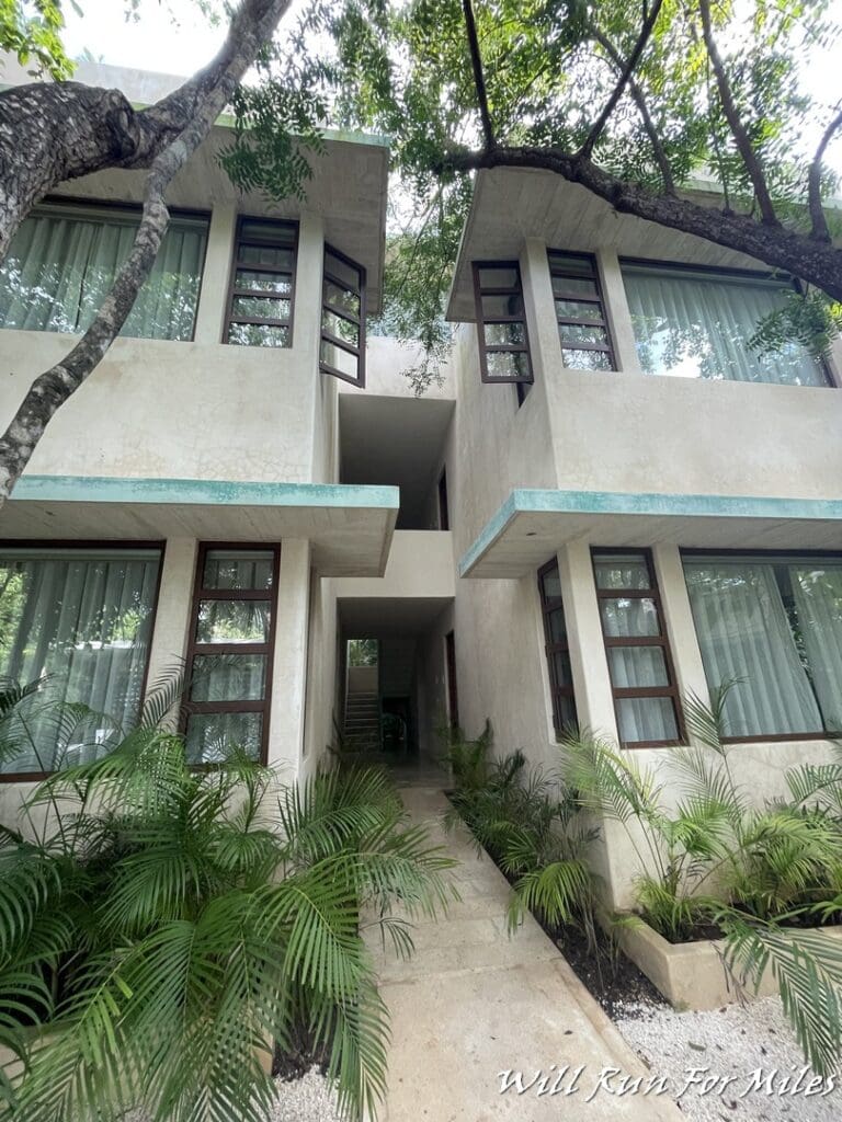 a building with trees and plants around it