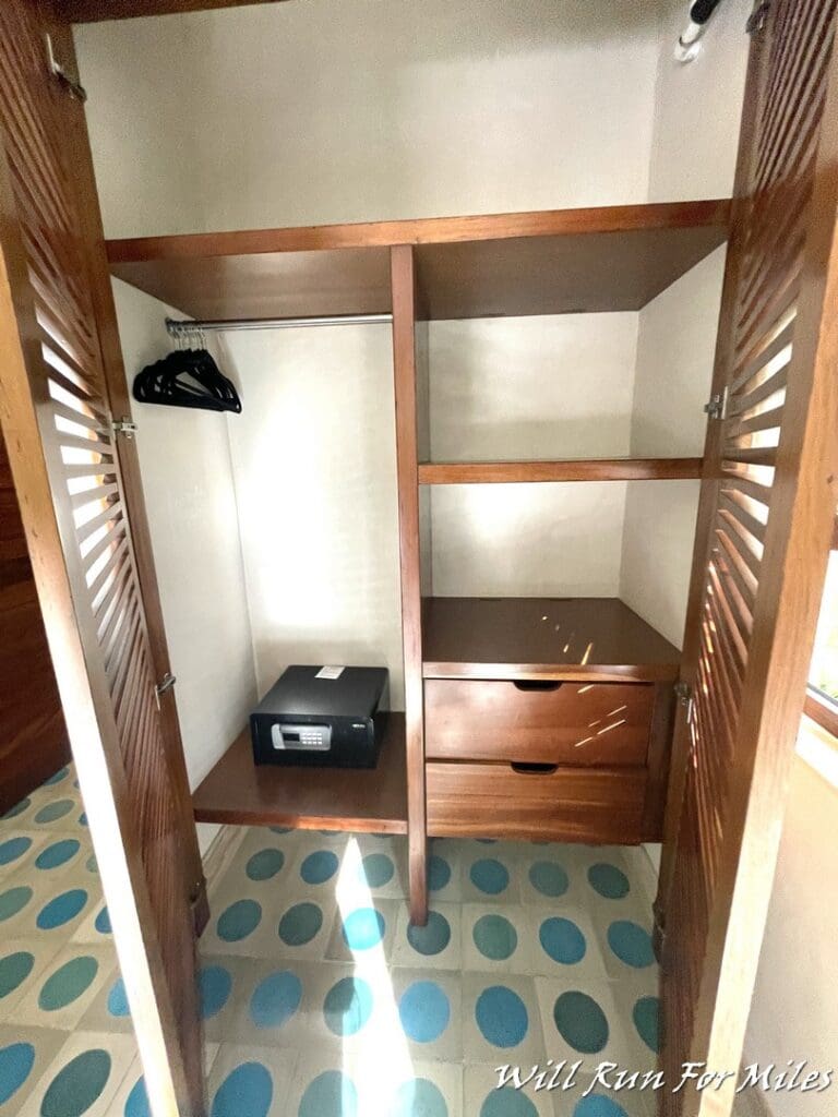 a closet with a radio and a shelf