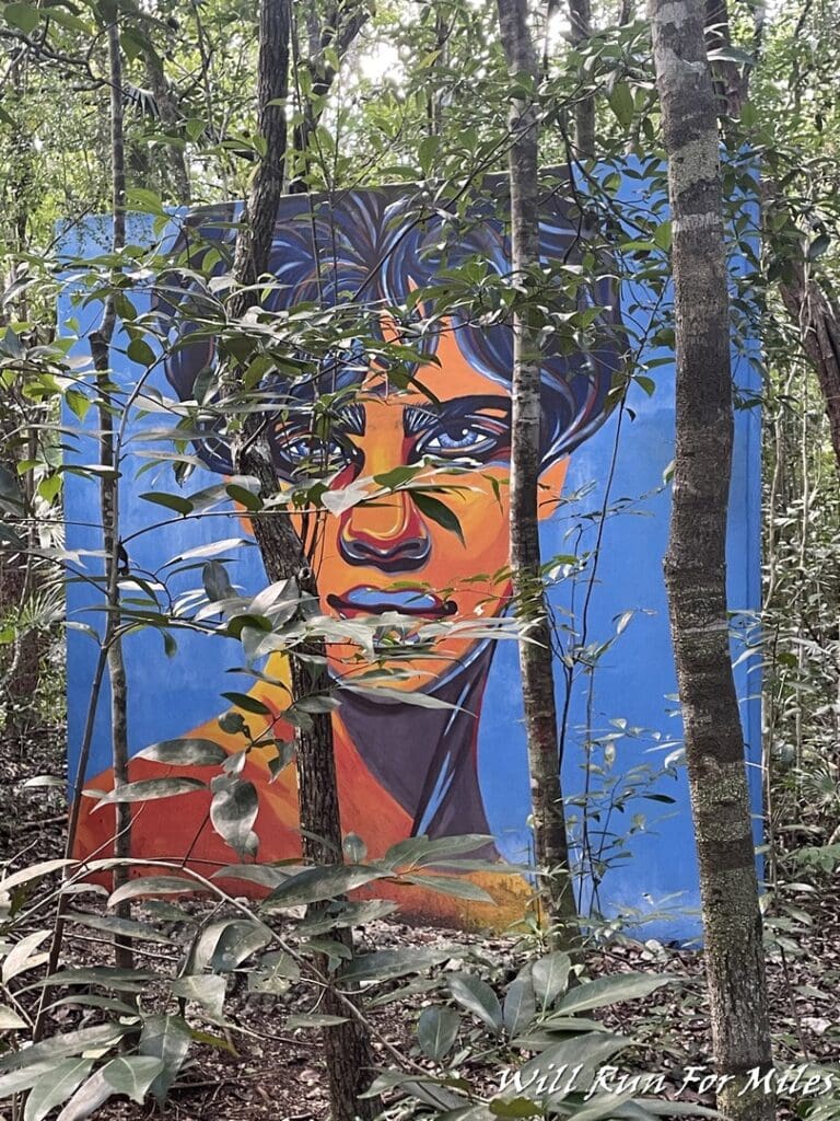 a mural of a man in the woods