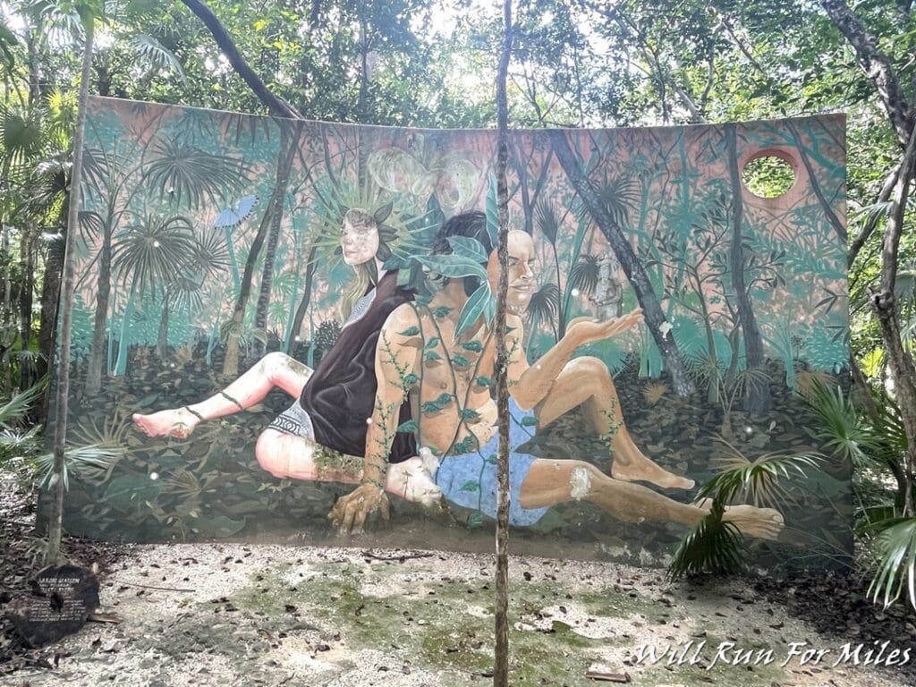 a mural of people sitting on a tree