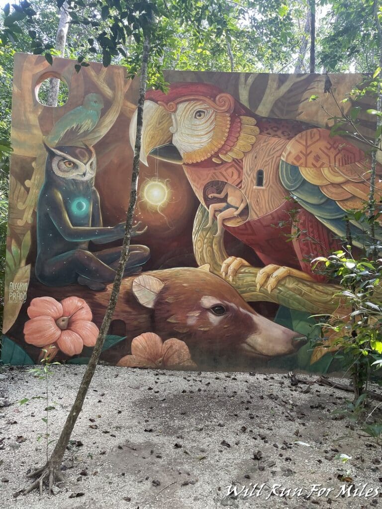 a mural of owls and a bear in the woods