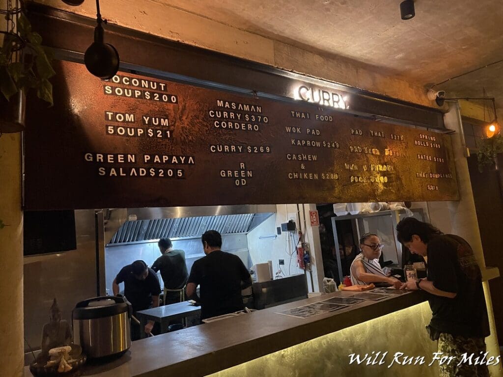 people at a counter in a restaurant