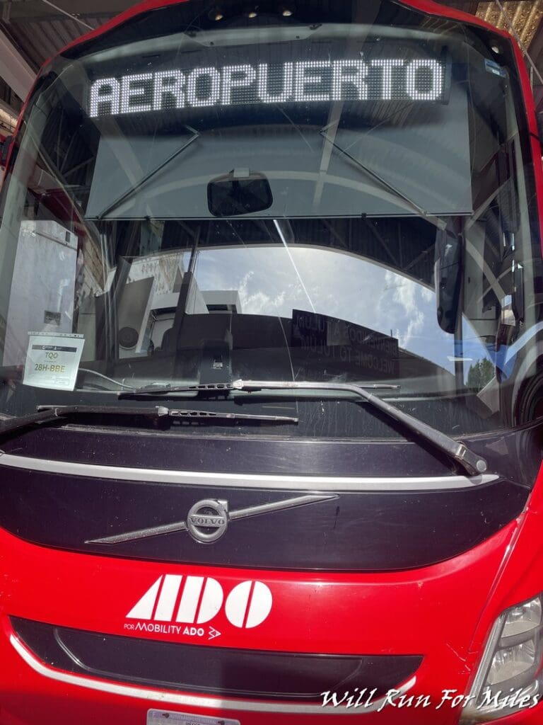 a front of a red bus