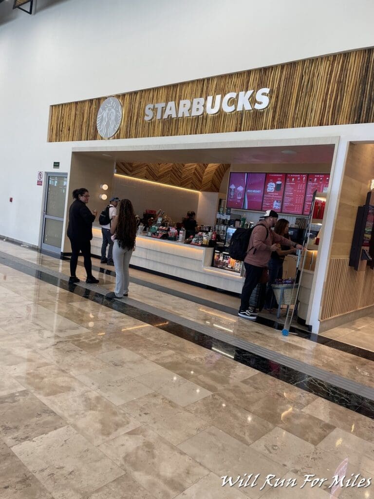 people standing in a line in a building