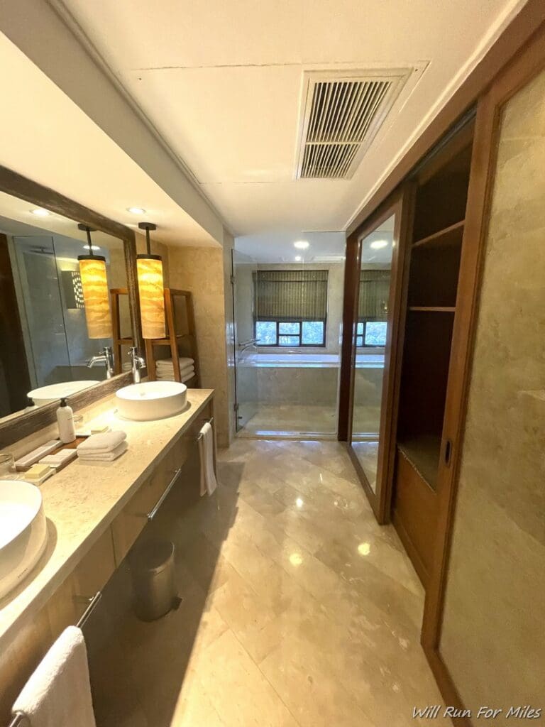 a bathroom with a large mirror and sinks