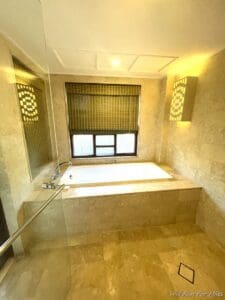 a bathroom with a tub and a shower