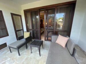 a patio with a couch and chairs