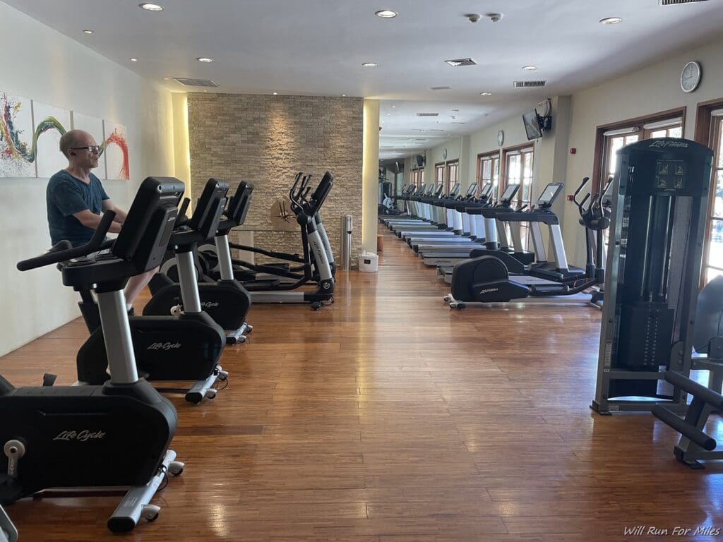 a man on a treadmill in a gym