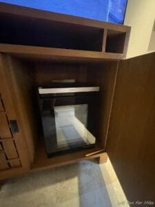 a cabinet with a glass door