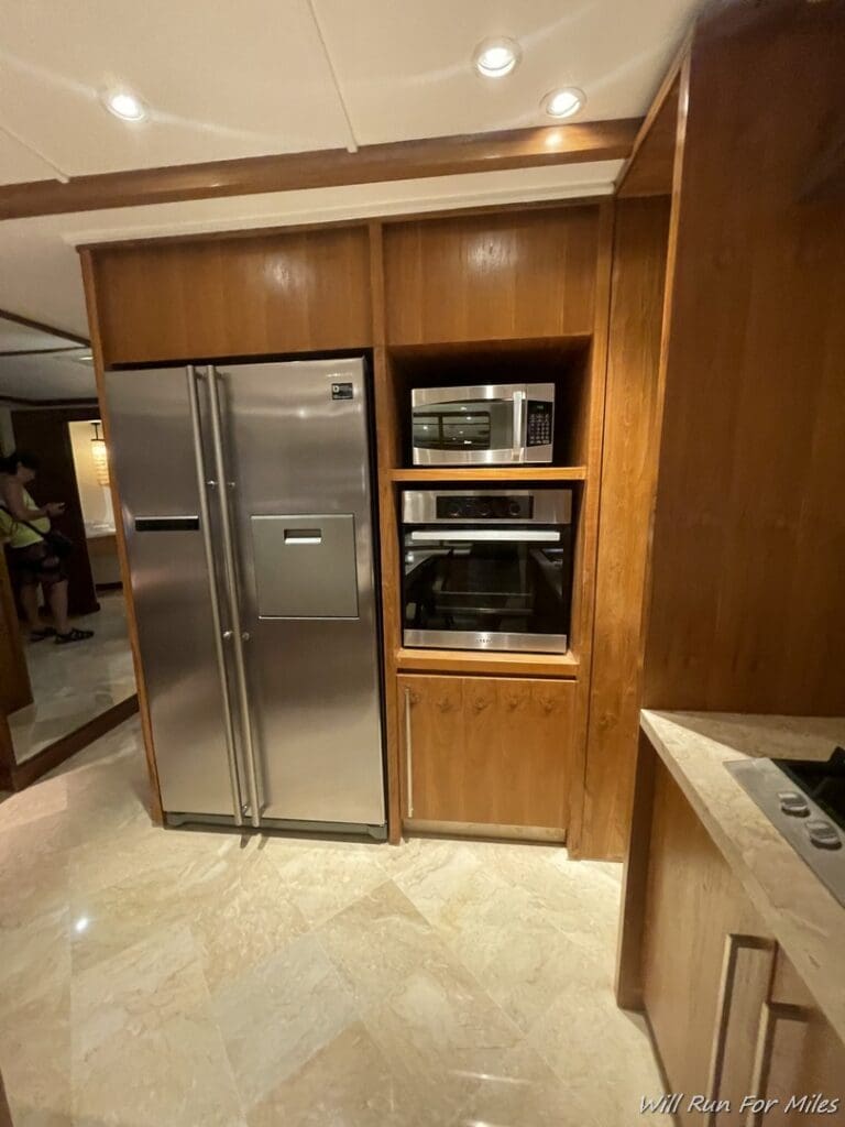 a kitchen with a refrigerator and microwave