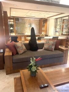 a guitar case on a couch in a room