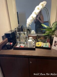 a woman taking a picture of a mirror