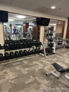 a room with weights and a mirror