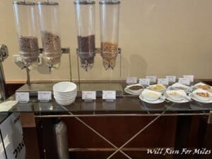 a row of cereal dispensers on a table