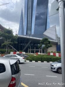 a building with a glass roof and a tall glass building