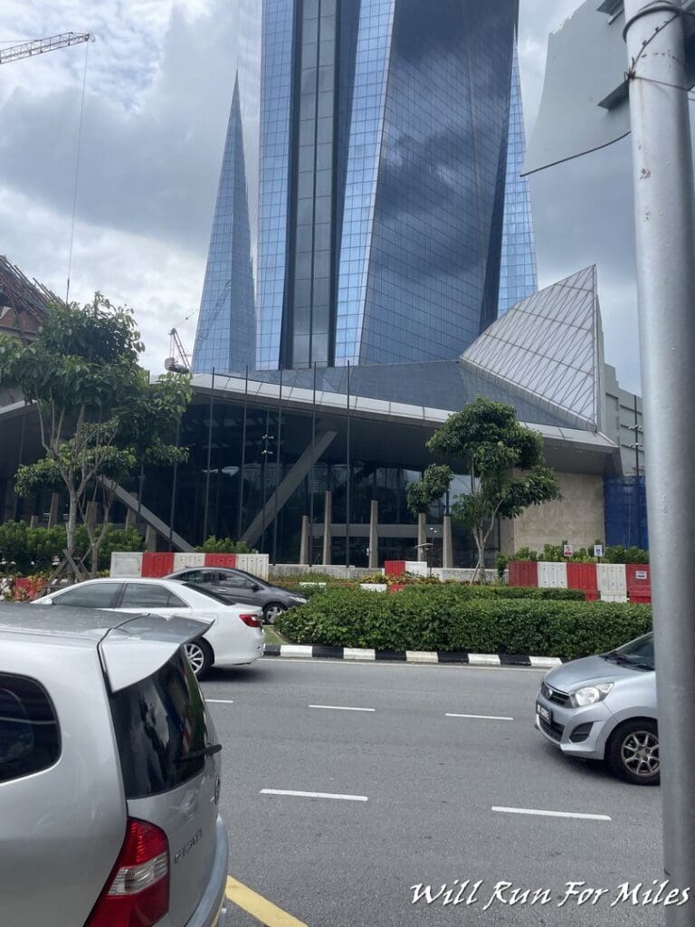 a building with a glass roof and a tall glass building