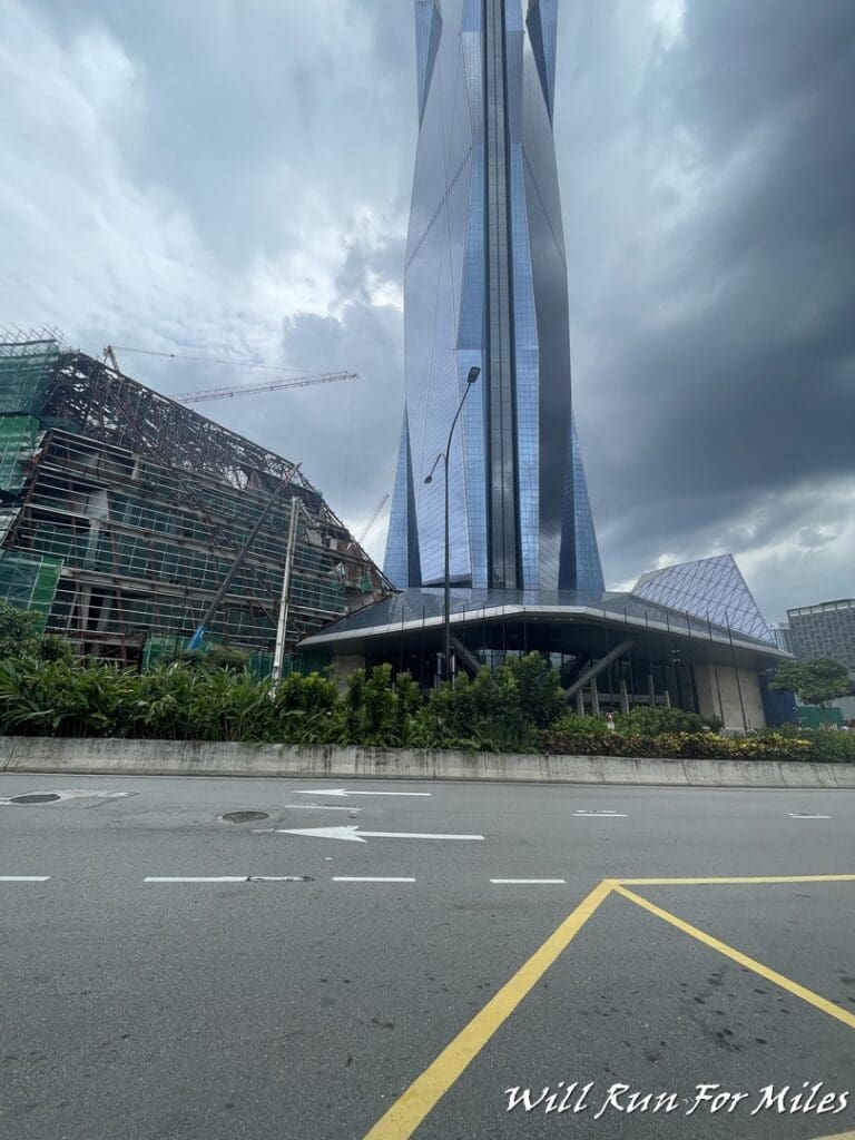 a tall building with a cloudy sky