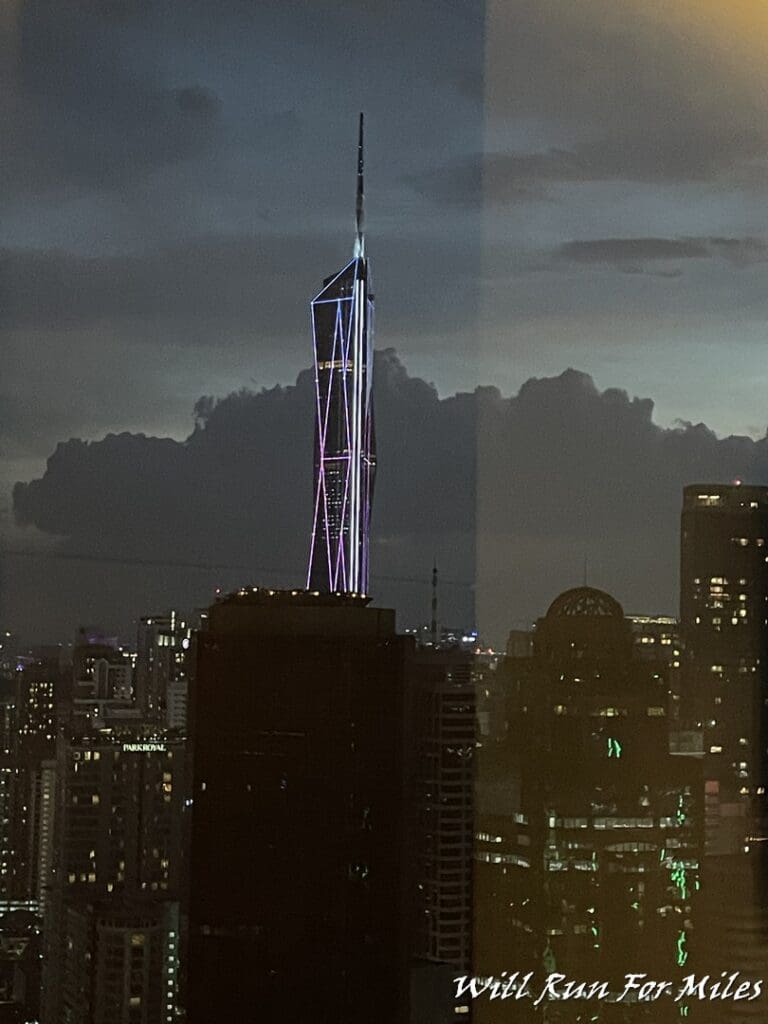 a tall building with lights on top of it