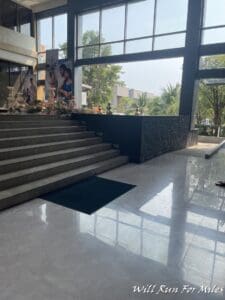 a person standing in front of a large staircase