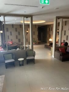 a room with a couch and chairs