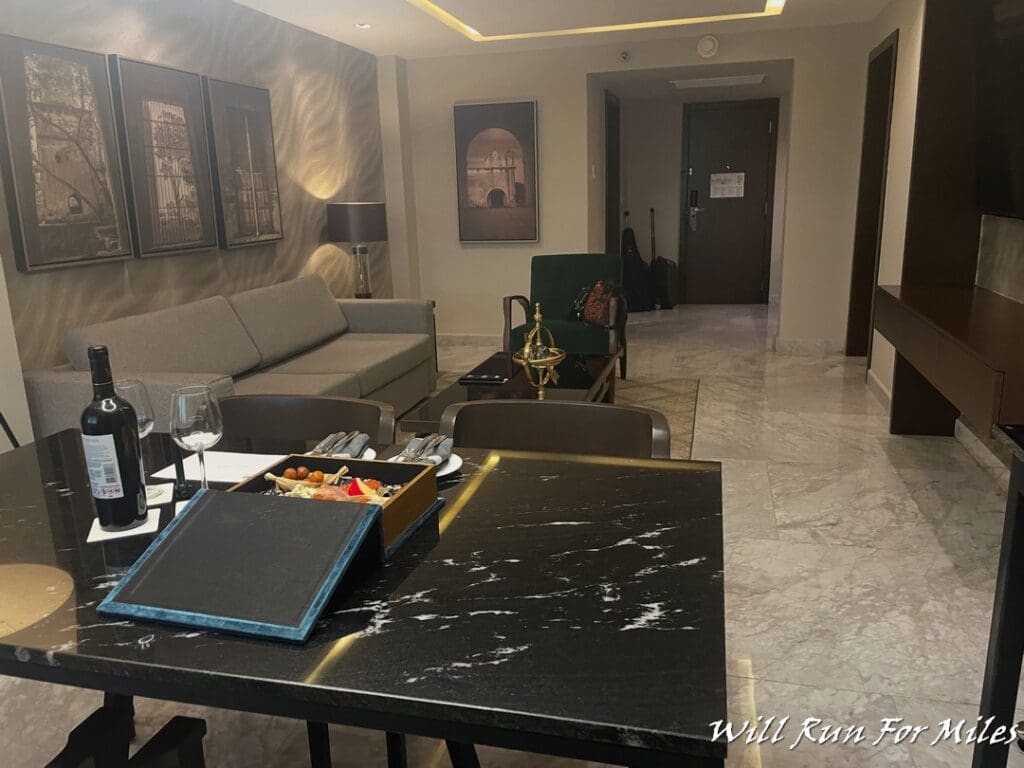 a room with a table and chairs and a couch
