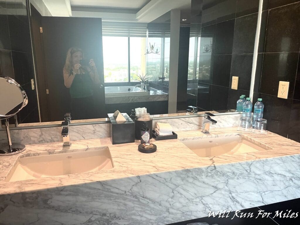 a bathroom with a mirror and sink