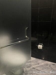 a bathroom with a toilet paper roll
