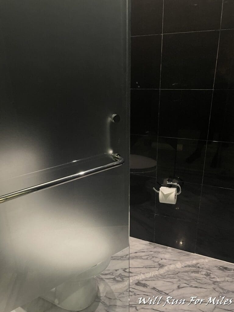 a bathroom with a toilet paper roll